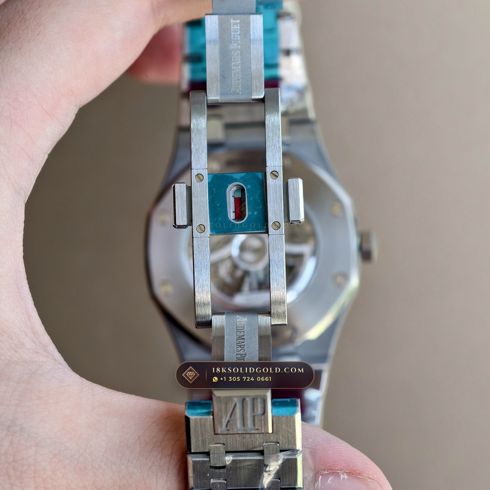 Audemars Piguet Royal Oak Double Balance Wheel Openworked 41mm Baguette Blue Topaz Bezel 18K White Gold Reference 15412BC.TO.1220BC.01 — Hallmarked Edition — Studio Angle 16 in 18K White Gold Au750 (224.8g Verified Mass, Audemars Piguet Cal. 3132 Dual-Balance Openworked)
