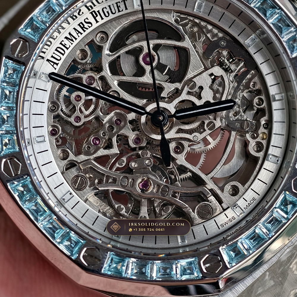 Audemars Piguet Royal Oak Double Balance Wheel Openworked 41mm Baguette Blue Topaz Bezel 18K White Gold Reference 15412BC.TO.1220BC.01 — Hallmarked Edition — Studio Angle 17 in 18K White Gold Au750 (224.8g Verified Mass, Audemars Piguet Cal. 3132 Dual-Balance Openworked)