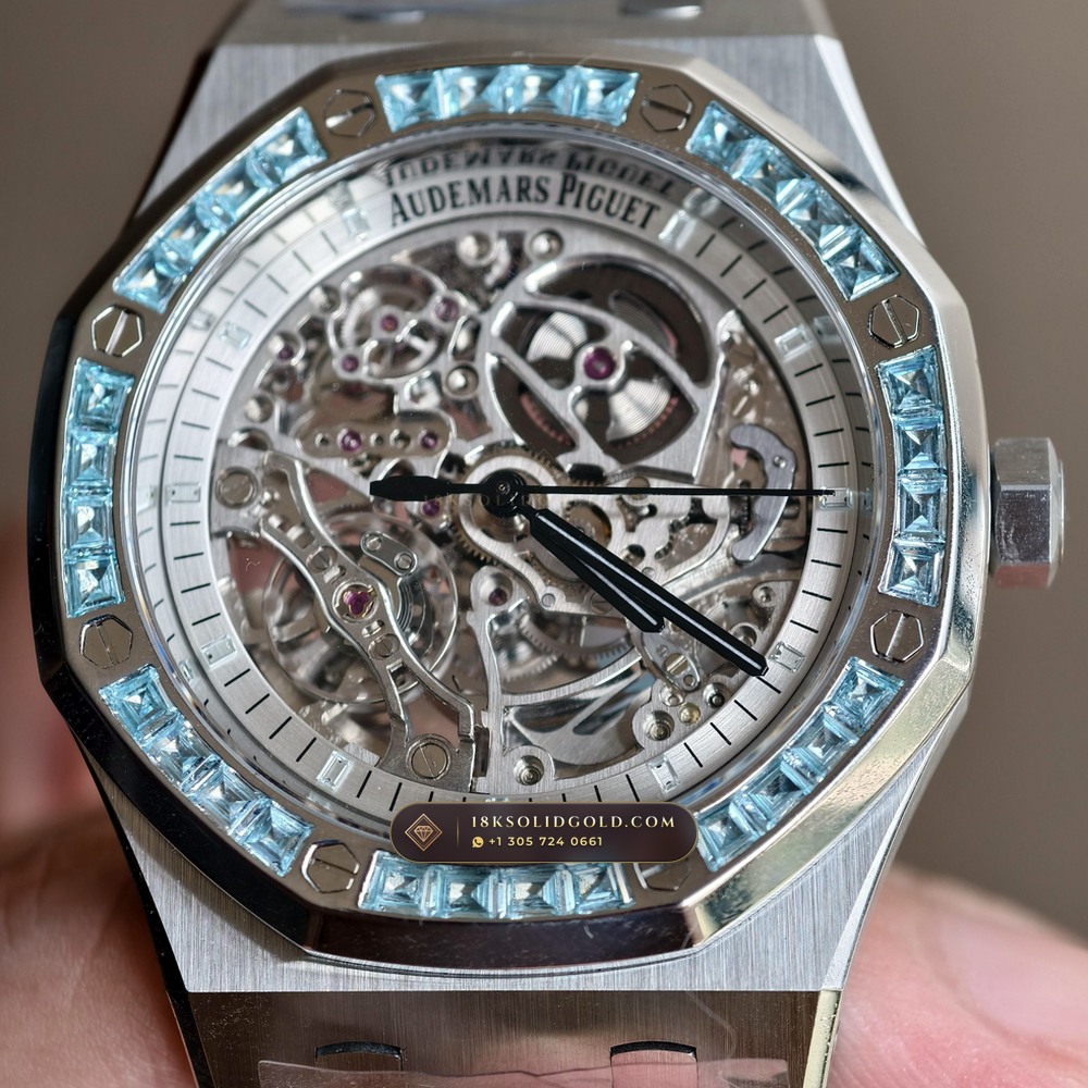 Audemars Piguet Royal Oak Double Balance Wheel Openworked 41mm Baguette Blue Topaz Bezel 18K White Gold Reference 15412BC.TO.1220BC.01 — Hallmarked Edition — Studio Gallery Plate VII in 18K White Gold Au750 (224.8g Verified Mass, Audemars Piguet Cal. 3132 Dual-Balance Openworked)