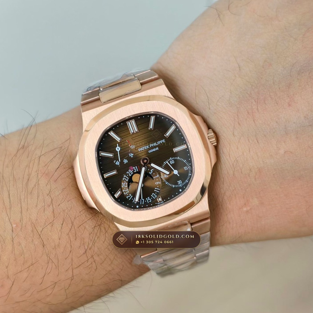 Patek Philippe Nautilus Moonphase & Power Reserve 18K Rose Gold Reference 5712/1R — Hallmarked Edition — Studio Gallery Plate VIII in 18K Rose Gold Au750 (186.5g Verified Mass, Patek Philippe Cal. 240 PS IRM C LU - 22K Gold Micro-Rotor)