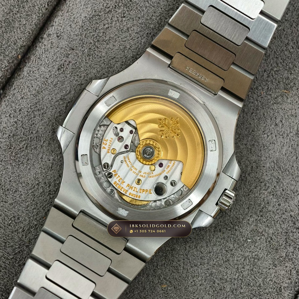 Patek Philippe Nautilus Self-Winding Baguette Ruby Bezel 950 Platinum Reference 5711/112P-001 — Hallmarked Edition — Studio Gallery Plate VIII in 950 Platinum Pt950 (245.1g Verified Mass, Patek Philippe Cal. 26-330 S C / Cal. 324 S C - 21K Gold Rotor)