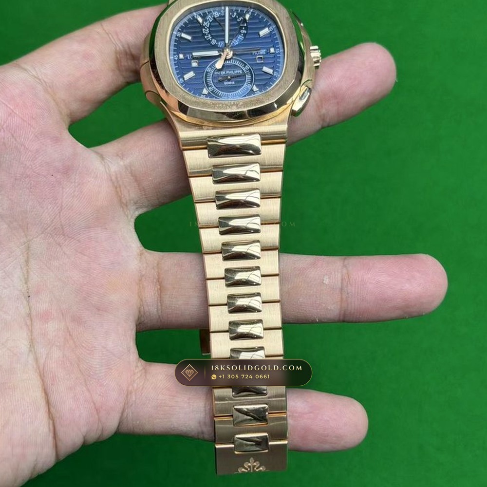 Patek Philippe Nautilus Travel Time Chronograph Sunburst Blue Dial 18K Rose Gold Reference 5990/1R-001 — Hallmarked Edition angle 3