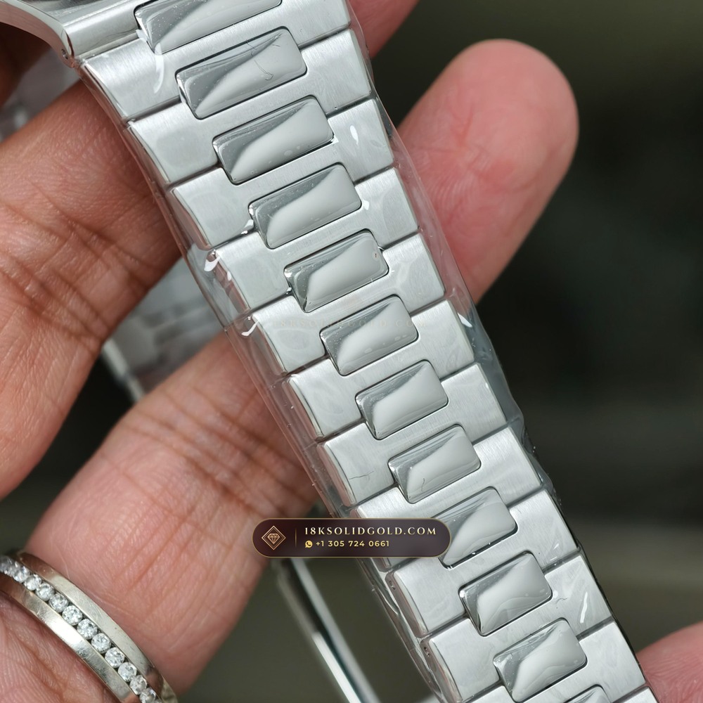 Patek Philippe Nautilus Off-Catalogue Baguette Ruby Bezel 950 Platinum Reference 5711/112P-001 — Hallmarked Edition — Studio Gallery Plate X in 950 Platinum Pt950 (245.4g Verified Mass, Patek Philippe Cal. 26-330 S C / Cal. 324 S C - 21K Gold Rotor)