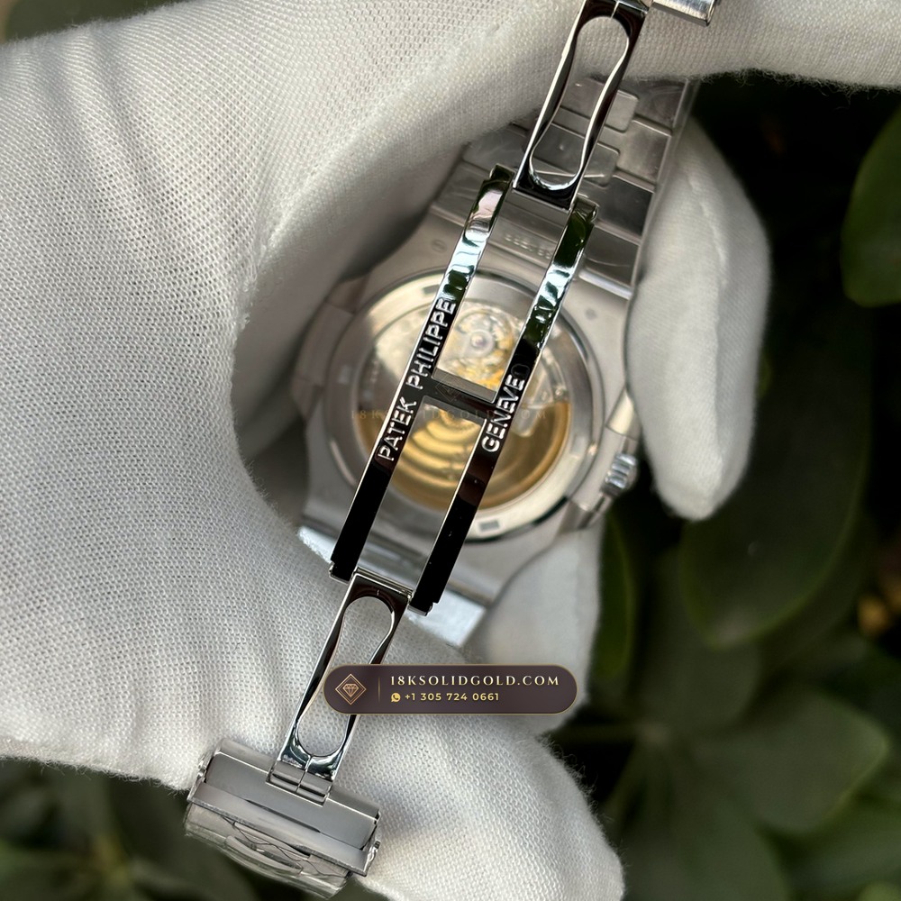 Patek Philippe Nautilus Off-Catalogue Baguette Ruby Bezel Diamond-Set Bezel 950 Platinum Reference 5711/112P-001 — Hallmarked Edition — Studio Gallery Plate IX in 950 Platinum Pt950 (244.6g Verified Mass, Patek Philippe Cal. 26-330 S C / Cal. 324 S C - 21K Gold Rotor)
