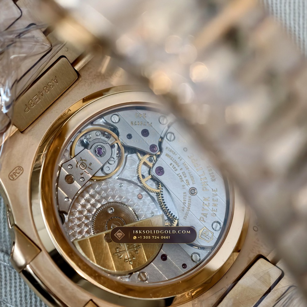 Patek Philippe Nautilus Moonphase & Power Reserve Diamond-Set Bezel 18K Rose Gold Reference 5712R — Hallmarked Edition — Studio Gallery Plate IX in 18K Rose Gold Au750 (106.0g Verified Mass, Patek Philippe Cal. 240 PS IRM C LU - 22K Gold Micro-Rotor)