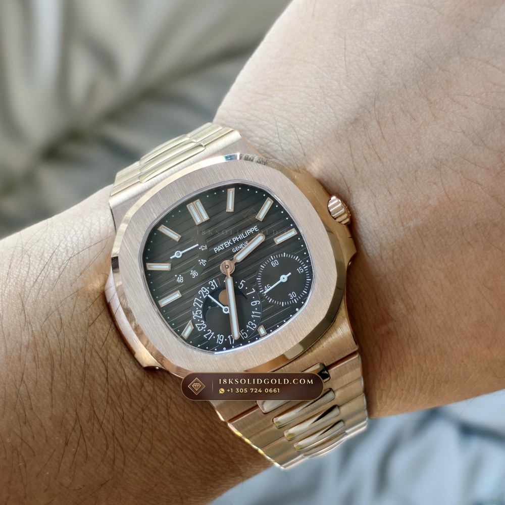 Patek Philippe Nautilus Moonphase & Power Reserve 18K Rose Gold Reference 5712R/001 — Hallmarked Edition — Studio Gallery Plate X in 18K Rose Gold Au750 (105.9g Verified Mass, Patek Philippe Cal. 240 PS IRM C LU - 22K Gold Micro-Rotor)
