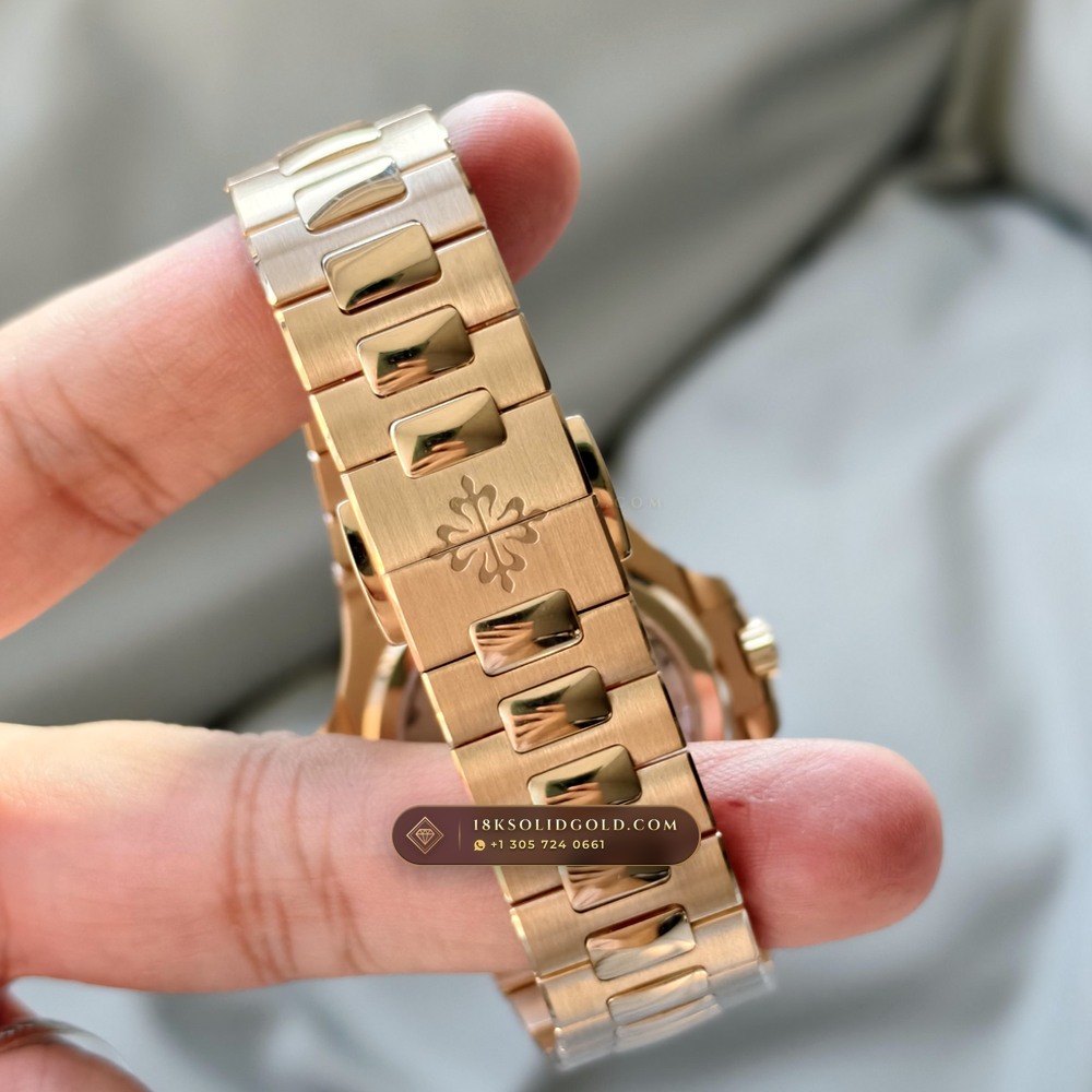 Patek Philippe Nautilus Moonphase & Power Reserve 18K Rose Gold Reference 5712R/001 — Hallmarked Edition — Studio Gallery Plate VII in 18K Rose Gold Au750 (105.9g Verified Mass, Patek Philippe Cal. 240 PS IRM C LU - 22K Gold Micro-Rotor)