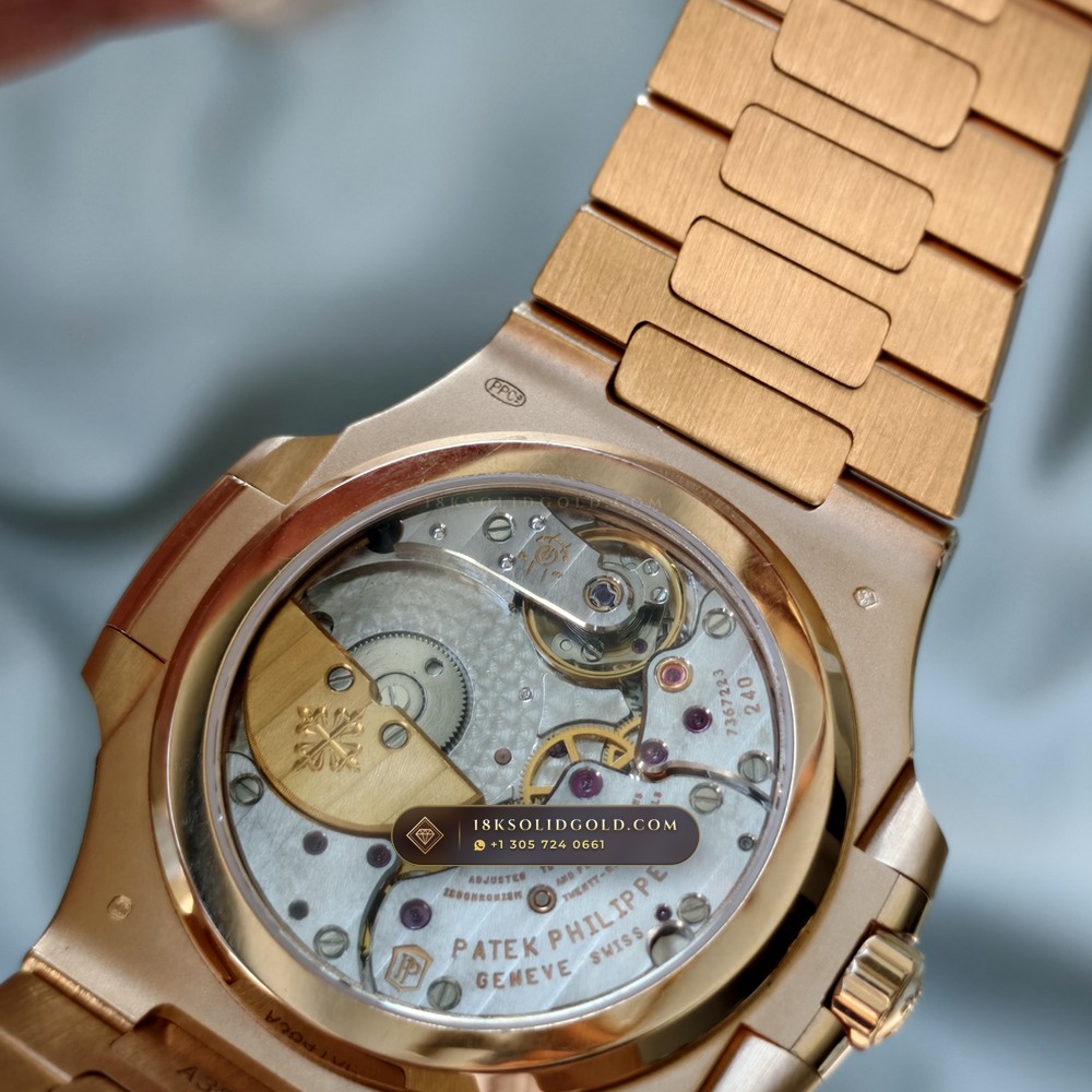 Patek Philippe Nautilus Moonphase & Power Reserve 18K Rose Gold Reference 5712R/001 — Hallmarked Edition — Studio Gallery Plate VIII in 18K Rose Gold Au750 (105.9g Verified Mass, Patek Philippe Cal. 240 PS IRM C LU - 22K Gold Micro-Rotor)