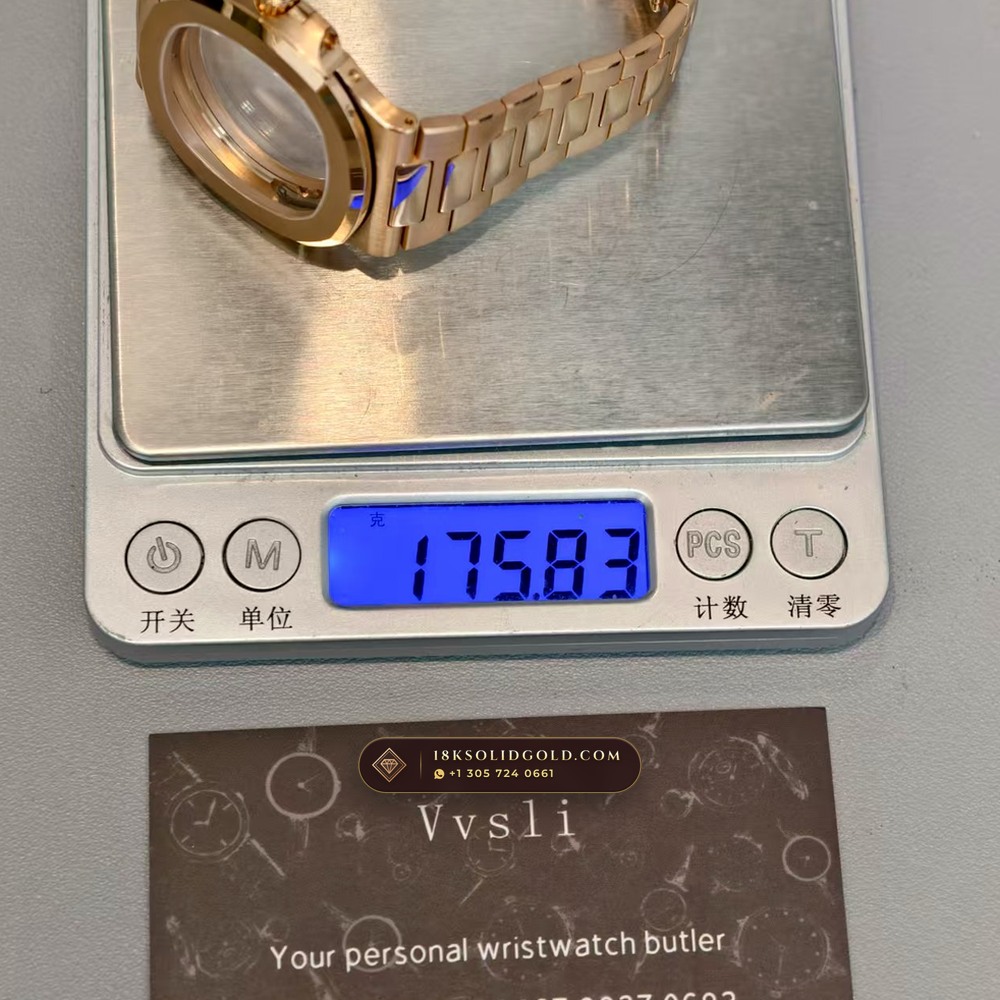 Patek Philippe Nautilus Moonphase & Power Reserve 18K Rose Gold Chronometer Regulated Spec Reference 5712/1R-001 — Hallmarked Edition — Studio Gallery Plate X in 18K Rose Gold Au750 (186.6g Verified Mass, Patek Philippe Cal. 240 PS IRM C LU - 22K Gold Micro-Rotor)