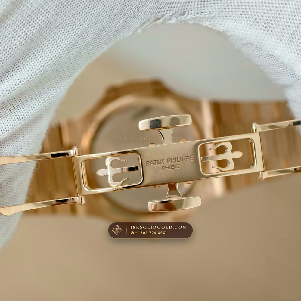 Patek Philippe Nautilus Moonphase & Power Reserve 18K Rose Gold Chronometer Regulated Spec Reference 5712/1R-001 — Hallmarked Edition — Studio Gallery Plate VII in 18K Rose Gold Au750 (186.6g Verified Mass, Patek Philippe Cal. 240 PS IRM C LU - 22K Gold Micro-Rotor)