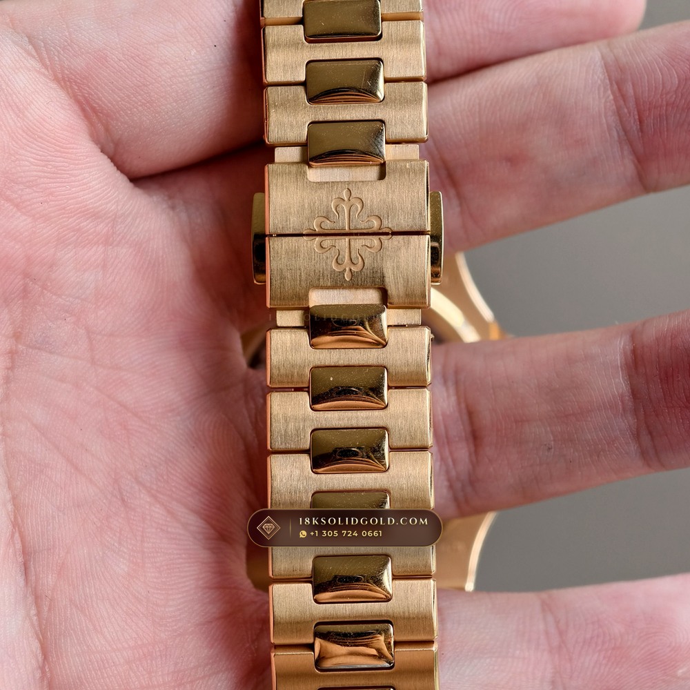 Patek Philippe Nautilus Moonphase & Power Reserve 18K Rose Gold Reference 5712/1R-001 — Hallmarked Edition — Studio Gallery Plate X in 18K Rose Gold Au750 (186.2g Verified Mass, Patek Philippe Cal. 240 PS IRM C LU - 22K Gold Micro-Rotor)