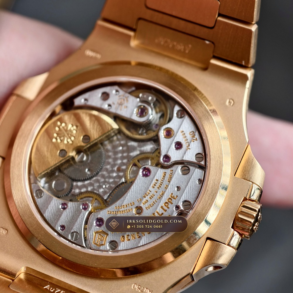 Patek Philippe Nautilus Moonphase & Power Reserve 18K Rose Gold Reference 5712/1R-001 — Hallmarked Edition — Studio Gallery Plate VII in 18K Rose Gold Au750 (186.2g Verified Mass, Patek Philippe Cal. 240 PS IRM C LU - 22K Gold Micro-Rotor)